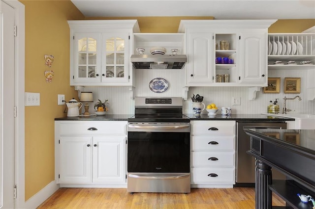 533 S Water St, Olathe, KS 66061 - kitchen featuring stainless steel electric stove, open shelves, white cabinets, light wood finished floors, and glass insert cabinets