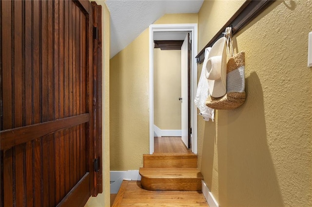 533 S Water St, Olathe, KS 66061 - stairs featuring a textured wall and wood finished floors