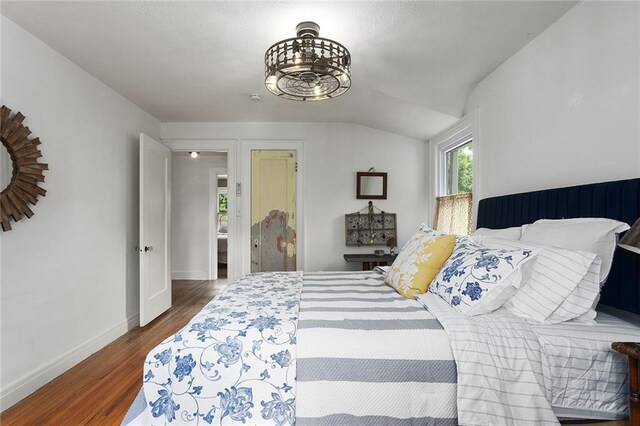 533 S Water St, Olathe, KS 66061 - bedroom featuring wood finished floors and vaulted ceiling