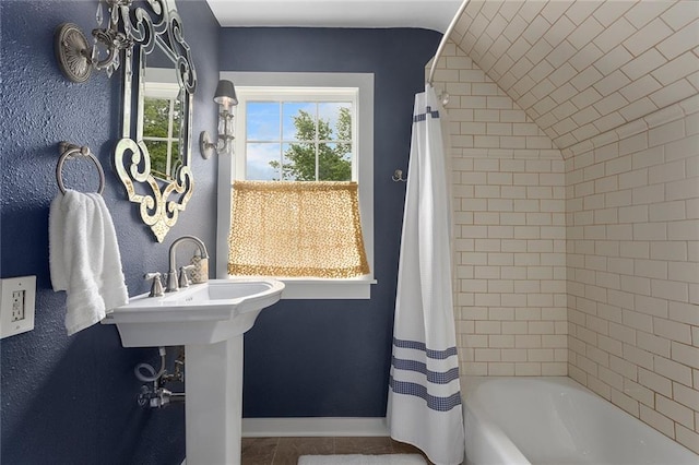 533 S Water St, Olathe, KS 66061 - full bathroom with shower / bath combo with shower curtain, tile patterned flooring, and lofted ceiling