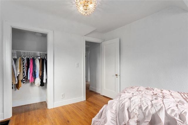 533 S Water St, Olathe, KS 66061 - bedroom with wood finished floors and a closet