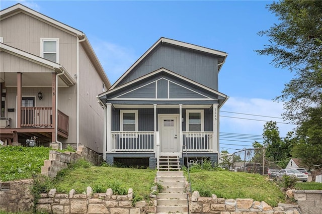 1116 Splitlog Ave, Kansas City, KS 66102 - view of front of home with a porch, stairs, and a front yard