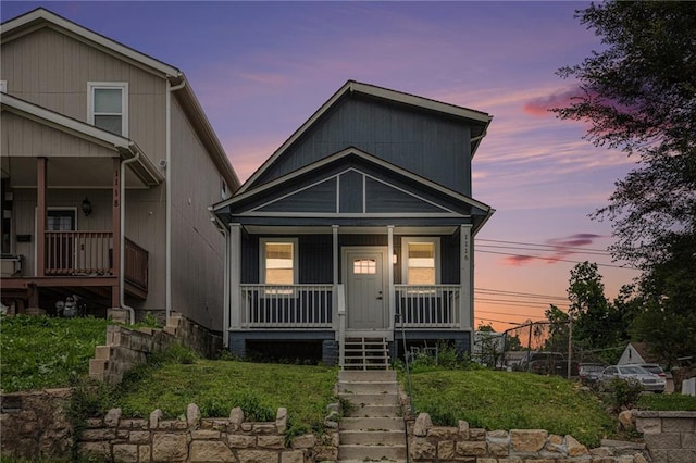 1116 Splitlog Ave, Kansas City, KS 66102 - view of front of house featuring a porch and stairway