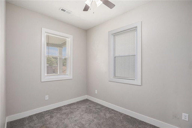 1116 Splitlog Ave, Kansas City, KS 66102 - unfurnished room featuring dark carpet and a ceiling fan