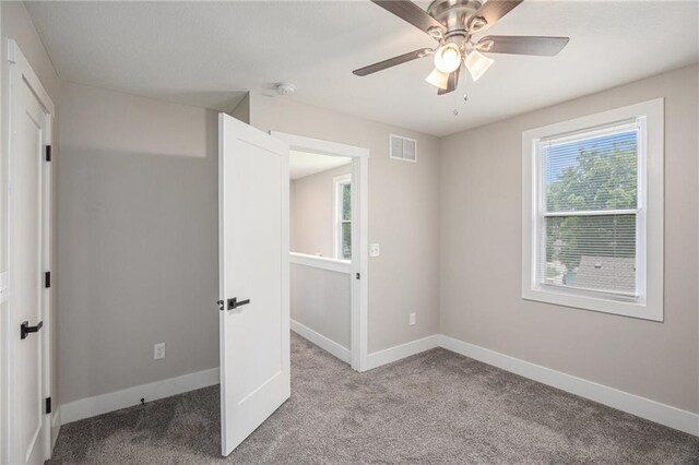 1116 Splitlog Ave, Kansas City, KS 66102 - unfurnished bedroom with carpet floors and ceiling fan