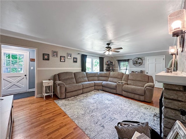 1607 S St, Lexington, MO 64067 - living room featuring ornamental molding, light wood-style floors, and a ceiling fan