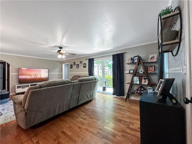 1607 S St, Lexington, MO 64067 - living area with wood finished floors, ceiling fan, crown molding, and arched walkways