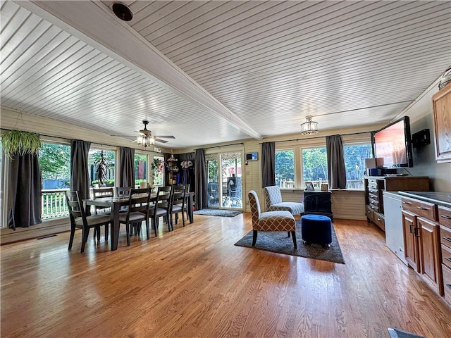 1607 S St, Lexington, MO 64067 - dining area with healthy amount of natural light, light wood-type flooring, beam ceiling, and ceiling fan
