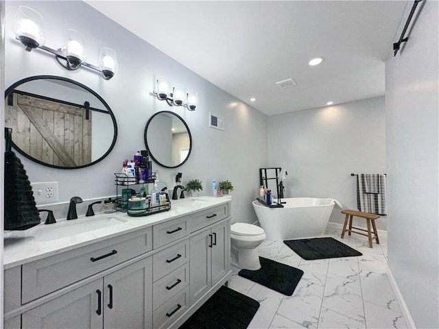 1607 S St, Lexington, MO 64067 - full bath with marble finish floors, double vanity, a freestanding tub, and recessed lighting