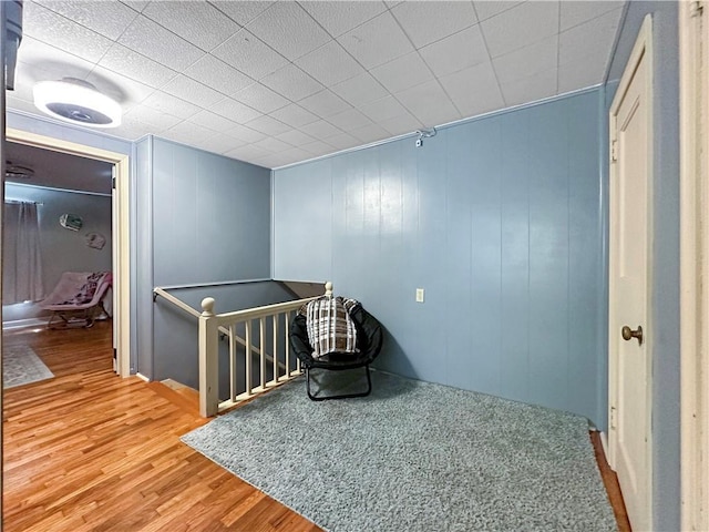 1607 S St, Lexington, MO 64067 - corridor featuring wood finished floors and an upstairs landing