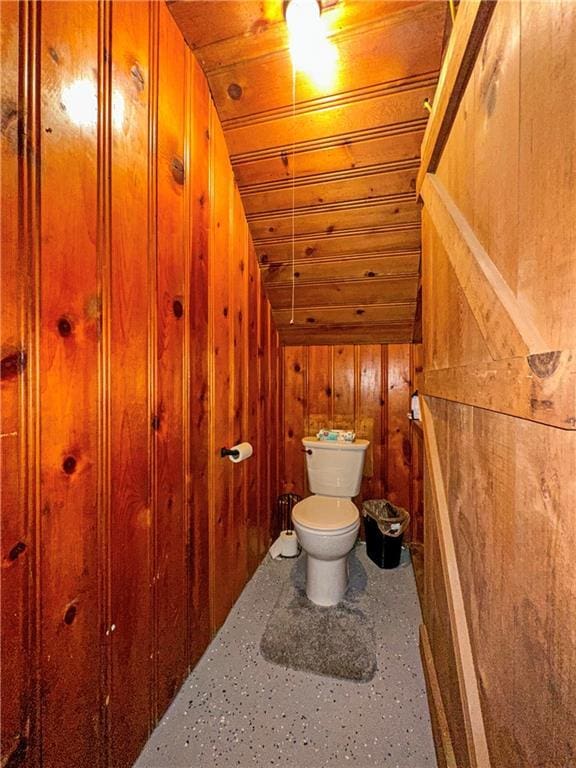 1607 S St, Lexington, MO 64067 - bathroom featuring lofted ceiling, wooden walls, and wood ceiling