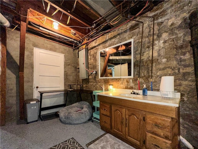 1607 S St, Lexington, MO 64067 - unfinished basement featuring a sink and electric panel