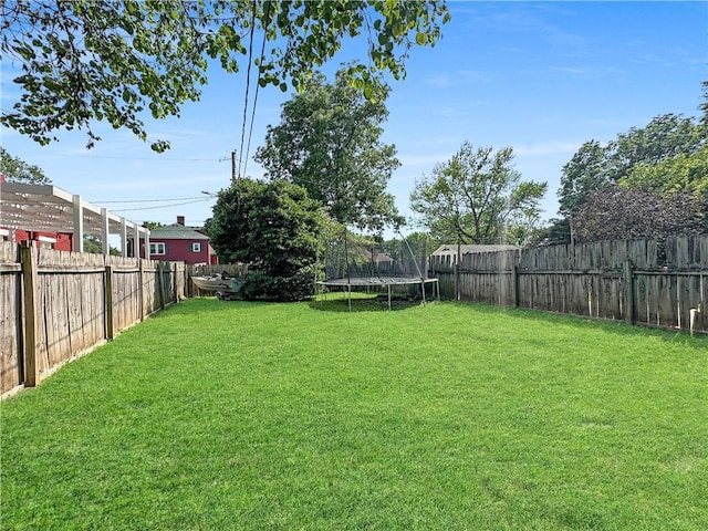 1607 S St, Lexington, MO 64067 - fenced backyard featuring a trampoline