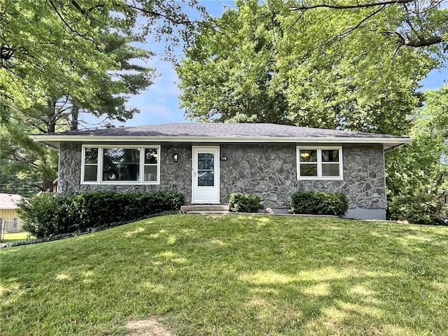 118 Fern St, Lansing, KS 66043 - view of front facade with stone siding and a front yard