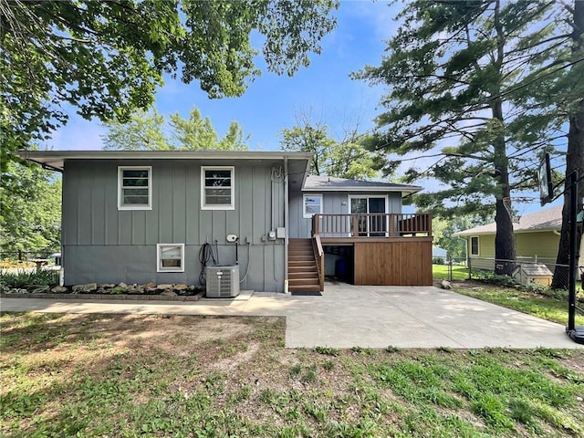 118 Fern St, Lansing, KS 66043 - rear view of house featuring a patio, a deck, stairway, and board and batten siding