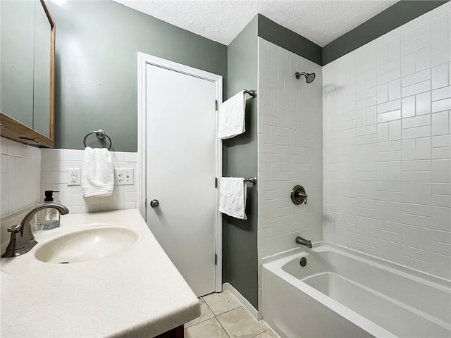 118 Fern St, Lansing, KS 66043 - full bath featuring bathing tub / shower combination, tile patterned floors, vanity, and a textured ceiling