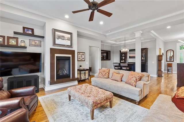 11717 S Barth Rd, Olathe, KS 66061 - living room with a ceiling fan, light wood-style flooring, recessed lighting, crown molding, and ornate columns