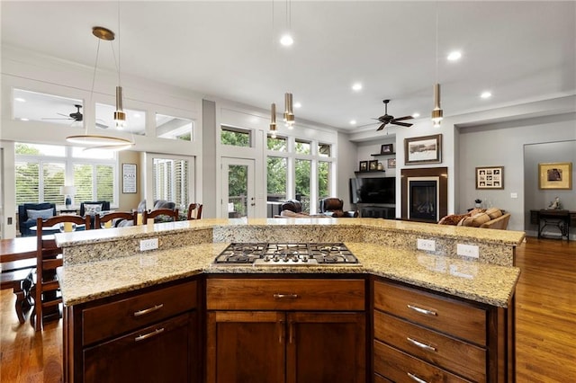 11717 S Barth Rd, Olathe, KS 66061 - kitchen featuring open floor plan, ceiling fan, stainless steel gas cooktop, recessed lighting, and ornamental molding