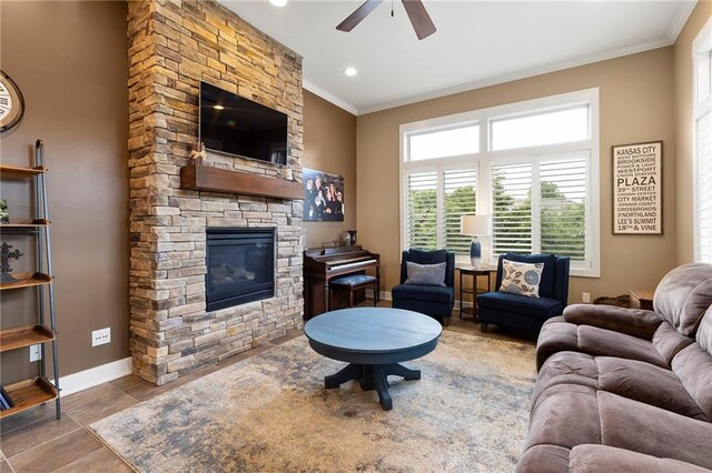 11717 S Barth Rd, Olathe, KS 66061 - tiled living room with ornamental molding, a ceiling fan, and a stone fireplace