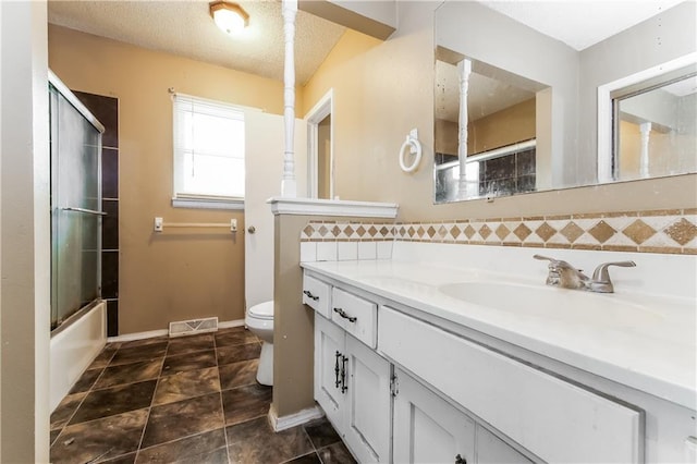 20408 E 15th Ter, Independence, MO 64056 - bathroom with vanity, bath / shower combo with glass door, and tile patterned flooring