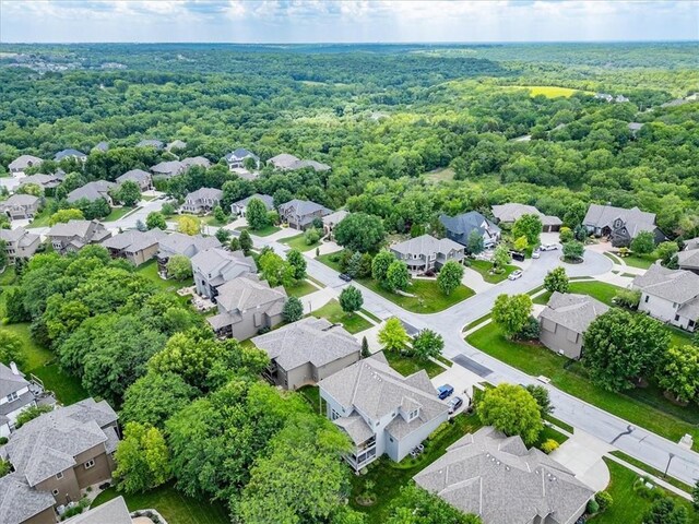 11599 S Carbondale St, Olathe, KS 66061 - aerial perspective of suburban area with a forest
