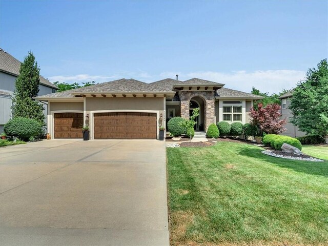 11599 S Carbondale St, Olathe, KS 66061 - mediterranean / spanish home with a garage, a front lawn, concrete driveway, and stucco siding