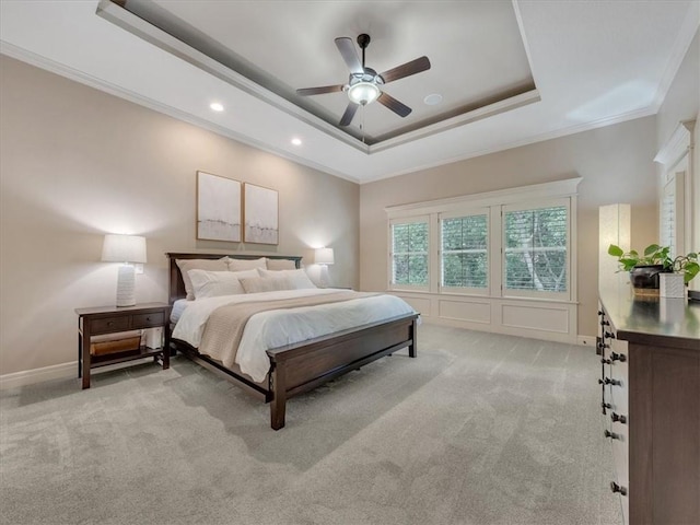 11599 S Carbondale St, Olathe, KS 66061 - bedroom with ornamental molding, a tray ceiling, light colored carpet, recessed lighting, and ceiling fan