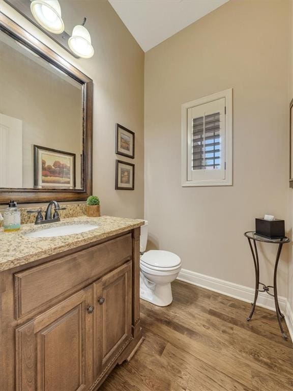 11599 S Carbondale St, Olathe, KS 66061 - half bathroom with wood finished floors and vanity
