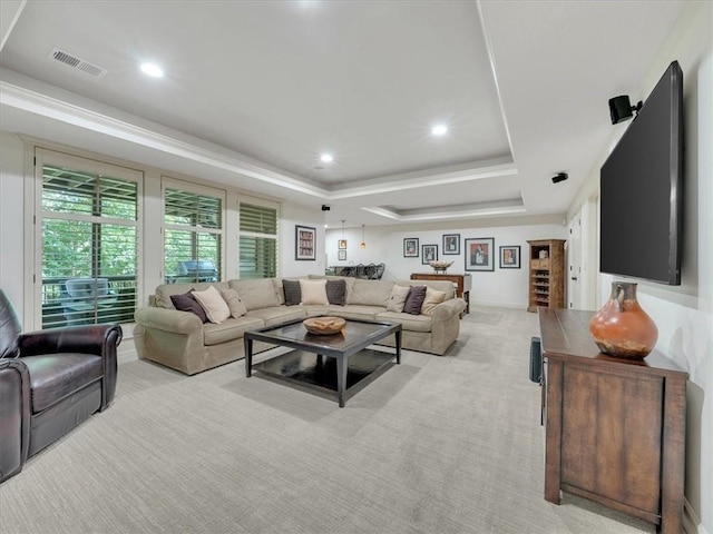 11599 S Carbondale St, Olathe, KS 66061 - living area featuring a tray ceiling, light colored carpet, and recessed lighting