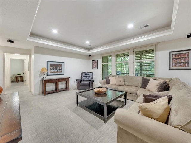 11599 S Carbondale St, Olathe, KS 66061 - living area featuring a tray ceiling, light carpet, and recessed lighting