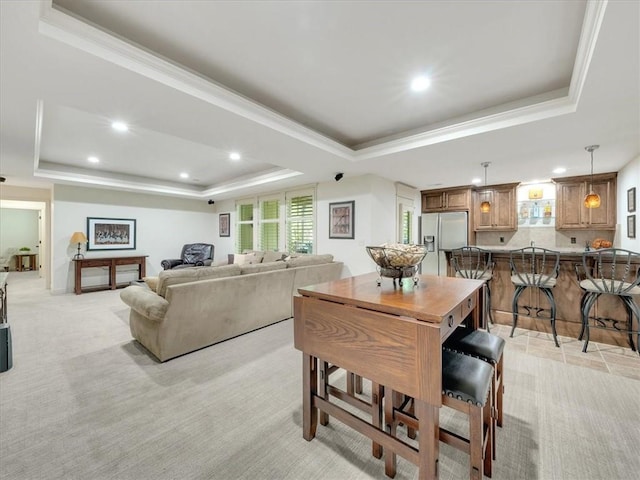 11599 S Carbondale St, Olathe, KS 66061 - dining area with a raised ceiling, recessed lighting, healthy amount of natural light, crown molding, and light carpet