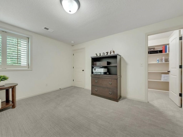 11599 S Carbondale St, Olathe, KS 66061 - unfurnished bedroom featuring a textured ceiling and carpet floors