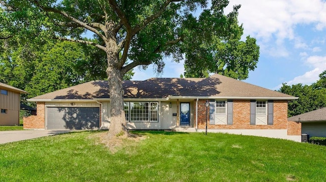 4309 S Huntington Way, Independence, MO 64055 - ranch-style home with driveway, brick siding, a garage, and a front lawn