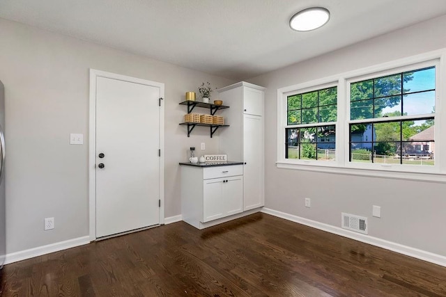 4309 S Huntington Way, Independence, MO 64055 - kitchen featuring open shelves, dark wood-type flooring, white cabinetry, and dark countertops