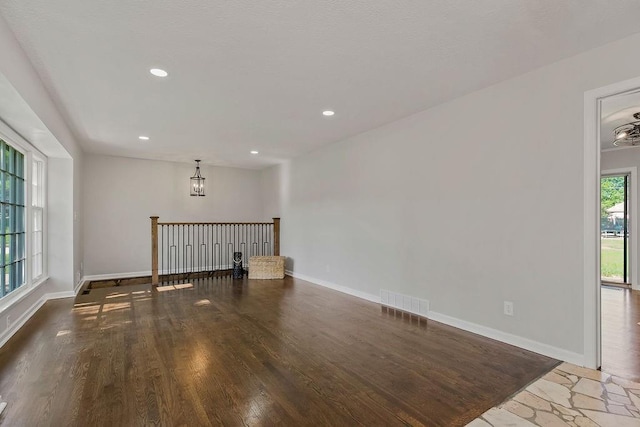 4309 S Huntington Way, Independence, MO 64055 - unfurnished room with wood finished floors, a chandelier, and recessed lighting