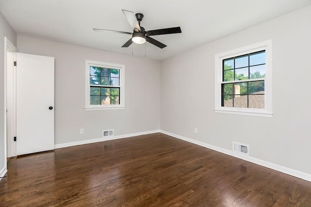 4309 S Huntington Way, Independence, MO 64055 - spare room featuring plenty of natural light, dark wood-type flooring, and ceiling fan