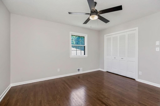 4309 S Huntington Way, Independence, MO 64055 - unfurnished bedroom with dark wood finished floors, a closet, and ceiling fan