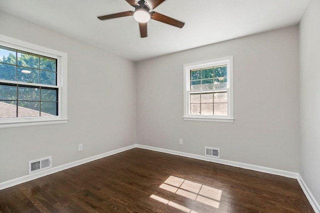 4309 S Huntington Way, Independence, MO 64055 - empty room with plenty of natural light, wood finished floors, and a ceiling fan
