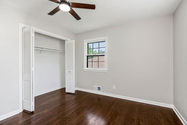4309 S Huntington Way, Independence, MO 64055 - unfurnished bedroom featuring wood finished floors, a closet, and ceiling fan