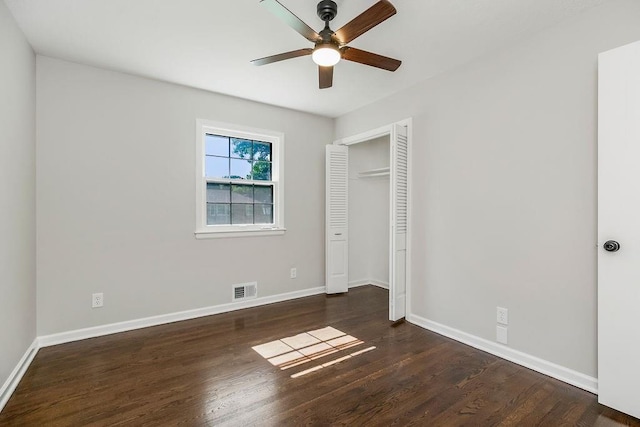 4309 S Huntington Way, Independence, MO 64055 - unfurnished bedroom with wood finished floors, a closet, and ceiling fan