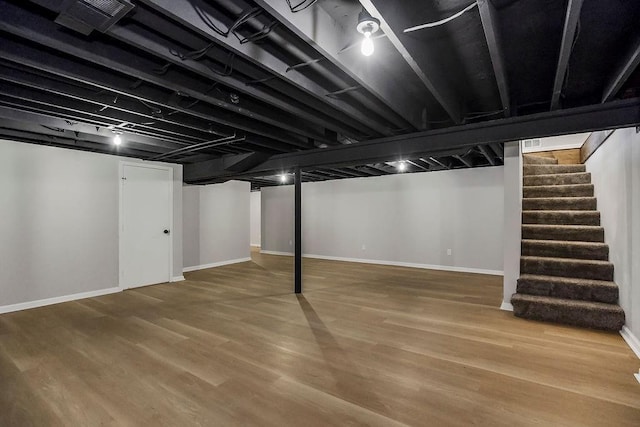 4309 S Huntington Way, Independence, MO 64055 - finished below grade area featuring wood finished floors and stairs