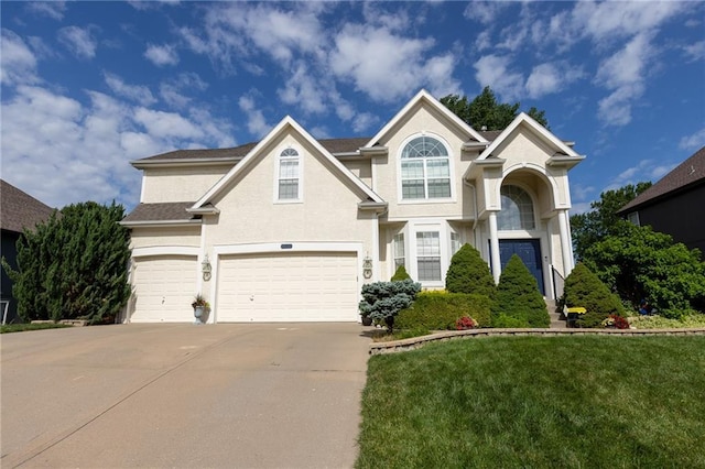 8620 N Eastern Ave, Kansas City, MO 64157 - traditional-style house featuring driveway, an attached garage, a front lawn, and stucco siding