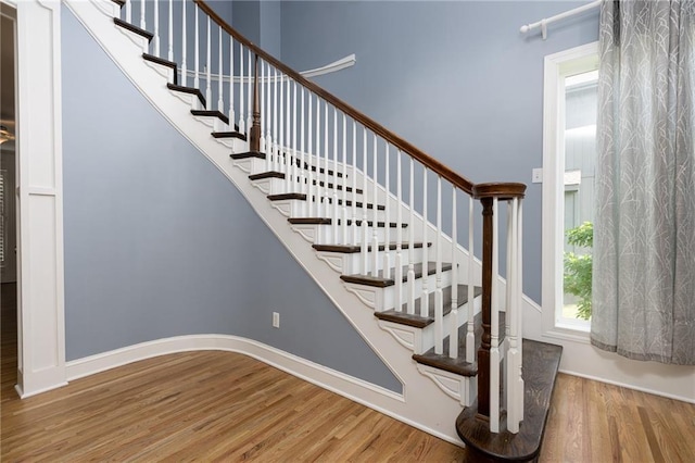 8620 N Eastern Ave, Kansas City, MO 64157 - stairs with wood finished floors