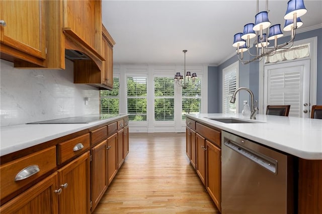 8620 N Eastern Ave, Kansas City, MO 64157 - kitchen with stainless steel dishwasher, a chandelier, black electric stovetop, light wood-type flooring, and light countertops