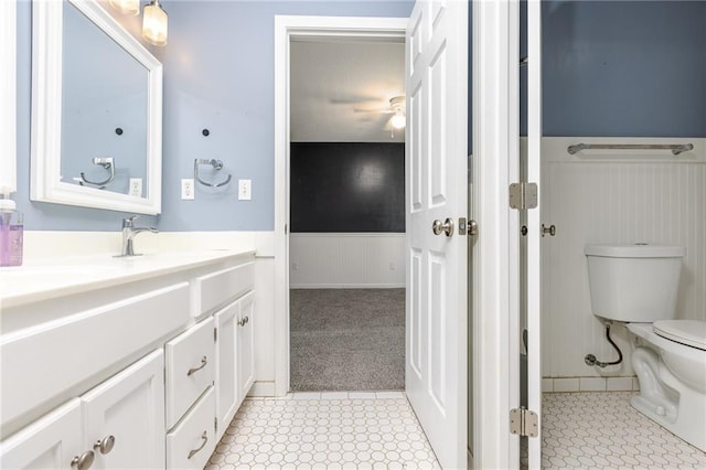 8620 N Eastern Ave, Kansas City, MO 64157 - bathroom featuring wainscoting, vanity, and tile patterned floors