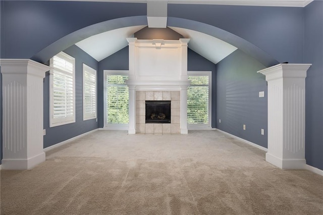 8620 N Eastern Ave, Kansas City, MO 64157 - unfurnished living room with carpet, a fireplace, vaulted ceiling, and arched walkways