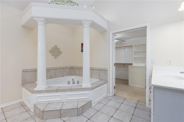 8620 N Eastern Ave, Kansas City, MO 64157 - full bathroom featuring ornate columns, a bath, vanity, a ceiling fan, and tile patterned floors