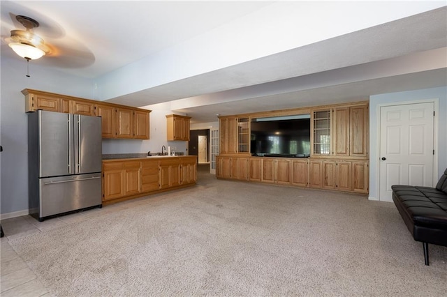 8620 N Eastern Ave, Kansas City, MO 64157 - kitchen featuring freestanding refrigerator, open floor plan, ceiling fan, and light carpet