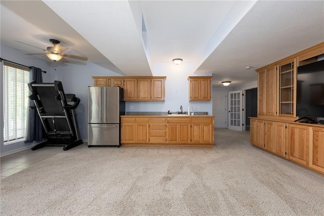 8620 N Eastern Ave, Kansas City, MO 64157 - kitchen featuring freestanding refrigerator, light carpet, and a ceiling fan