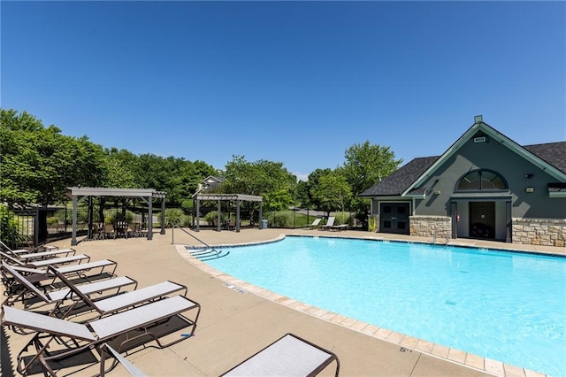 8620 N Eastern Ave, Kansas City, MO 64157 - community pool with a pergola, a patio, and view of wooded area
